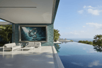 Chrome Infinity teal and chrome abstract artwork in a pool lounge