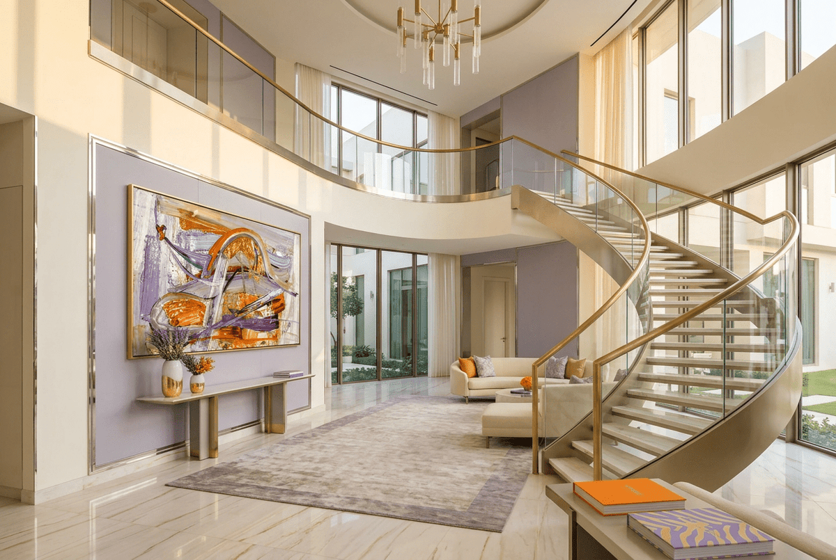 Gilded Traverse abstract artwork with a sweeping metallic gold and orange arc over lavender, violet and pale textured fields in a luxury two story foyer
