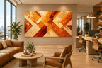Golden Convergence abstract geometric artwork with amber, crimson, gold and cream diagonal bands in an open-plan office