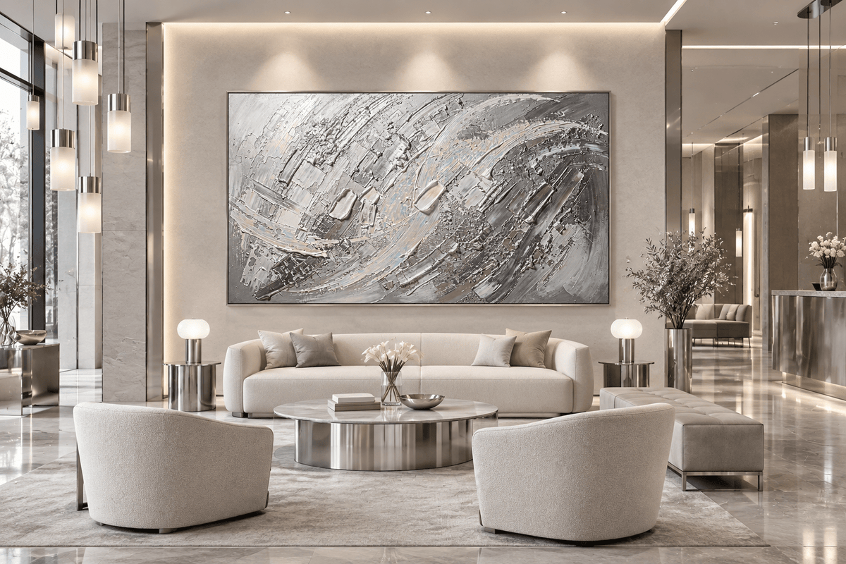 Mercury Rising gestural abstraction with silver, graphite, white and smoke-grey relief in a hotel lobby