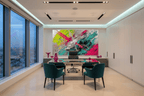 Neon Collision teal and magenta textural abstraction in a modern executive office