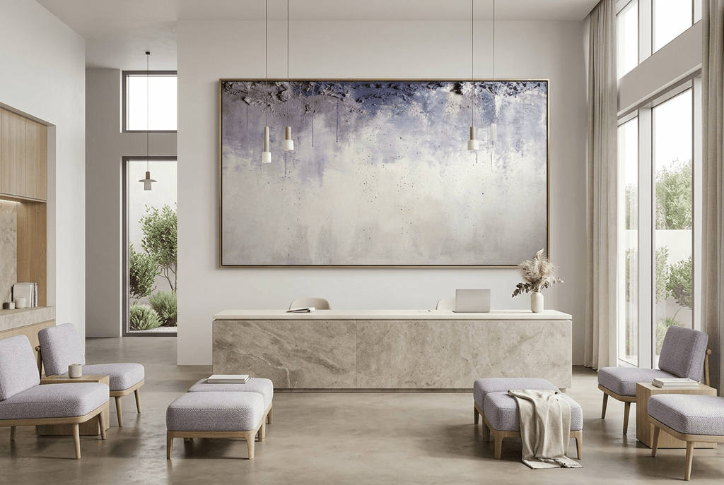 Overburden abstract artwork with a dark slate-violet plaster-like accumulation and fine drips above a chalk-white field with pale blue-grey veils in a private clinic with reception and waiting area
