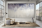 Overburden abstract artwork with a dark slate-violet plaster-like accumulation and fine drips above a chalk-white field with pale blue-grey veils in an industrial loft