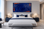 Ultramarine Ember Limited Edition monumental abstract artwork with deep ultramarine blue impasto, ember-orange edge strokes and textured horizontal layers in a modern hotel room