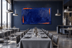 Ultramarine Ember Limited Edition monumental abstract artwork with deep ultramarine blue impasto, ember-orange edge strokes and textured horizontal layers in a modern restaurant