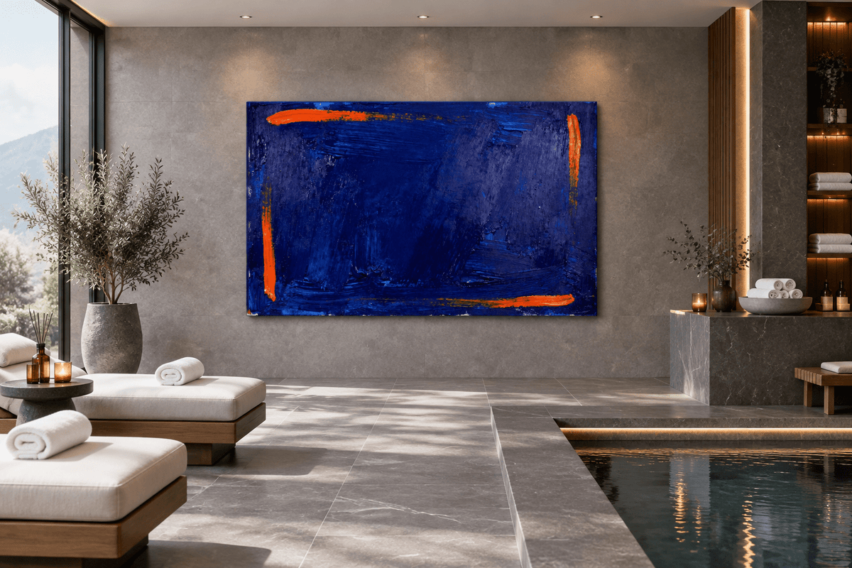 Ultramarine Ember Limited Edition monumental abstract artwork with deep ultramarine blue impasto, ember-orange edge strokes and textured horizontal layers in a wellness spa