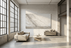 Unfilled Field abstract artwork with a pale cream and chalk-white textured field, a soft warm-grey diagonal drift, fine fissures, and a low stone-grey residue band in a modern industrial loft