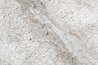 Zoom detail of Unfilled Field abstract artwork with a pale cream and chalk-white textured field, a soft warm-grey diagonal drift, fine fissures, and a low stone-grey residue band