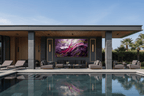 Violet Reign violet gestural artwork beside an outdoor pool lounge