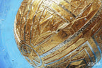 Zoom detail of Golden Sphere original abstract artwork with faceted golden geometric panels, engraved linear patterns and a luminous cobalt-blue ground.